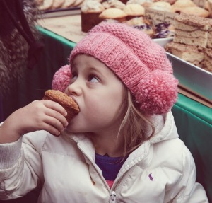 2014 Marathon Bake Sale child eating a muffin